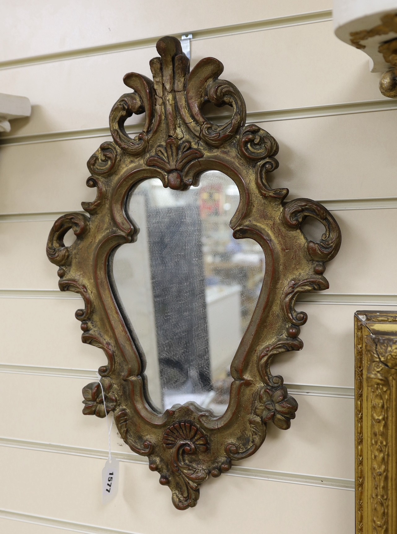 A girandole mirror and two wall brackets